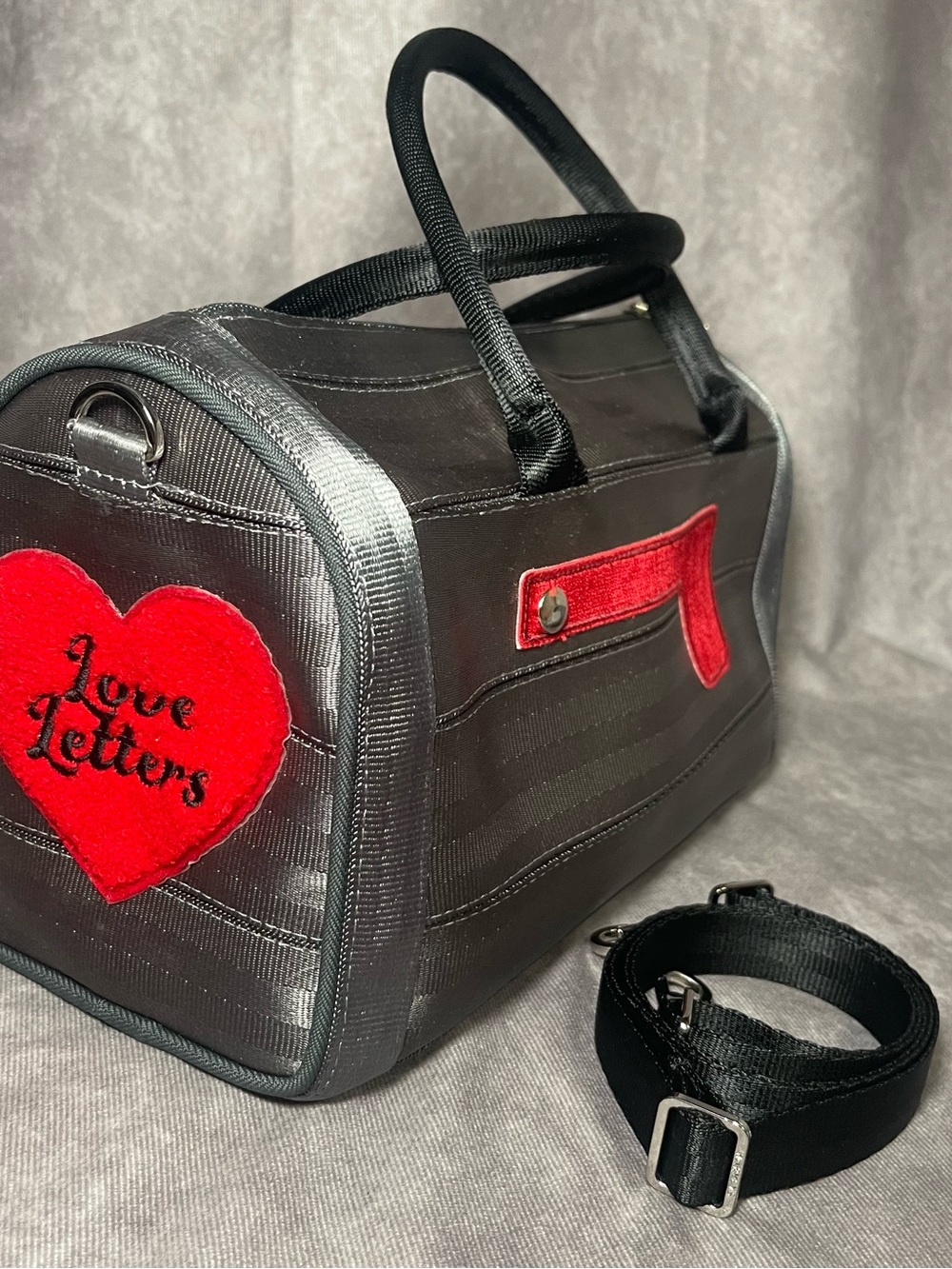 Harvey’s seatbelt collector series love letter mailbox crossbody purse